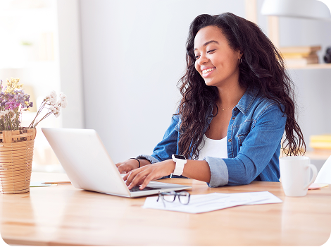 Woman using laptop to search trademarks